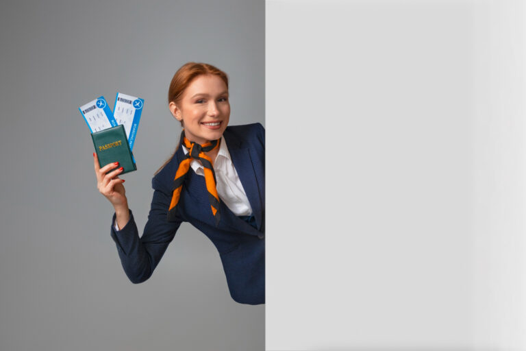 Flight attendant holding plane tickets and passport - illustrative photo.