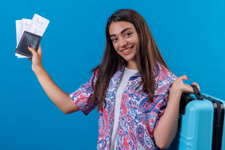 A woman holding her travel documents. 